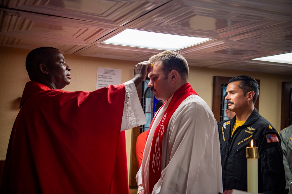 Sailors Participate In A Roman Catholic Church Service