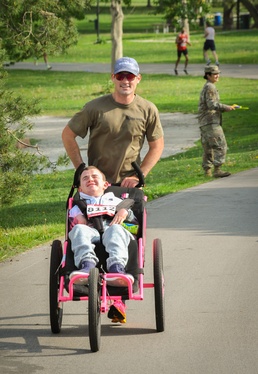 Nick and Sam: Kansas Army National Guard Soldier makes All Guard Marathon Team while pushing best friend to the finish