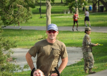 Nick and Sam: Kansas Army National Guard Soldier makes All Guard Marathon Team while pushing best friend to the finish