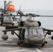 Task Force Mustang UH-60 Blackhawk and AH-64 Apache Flight Crews, land on the USS Lewis B. Puller