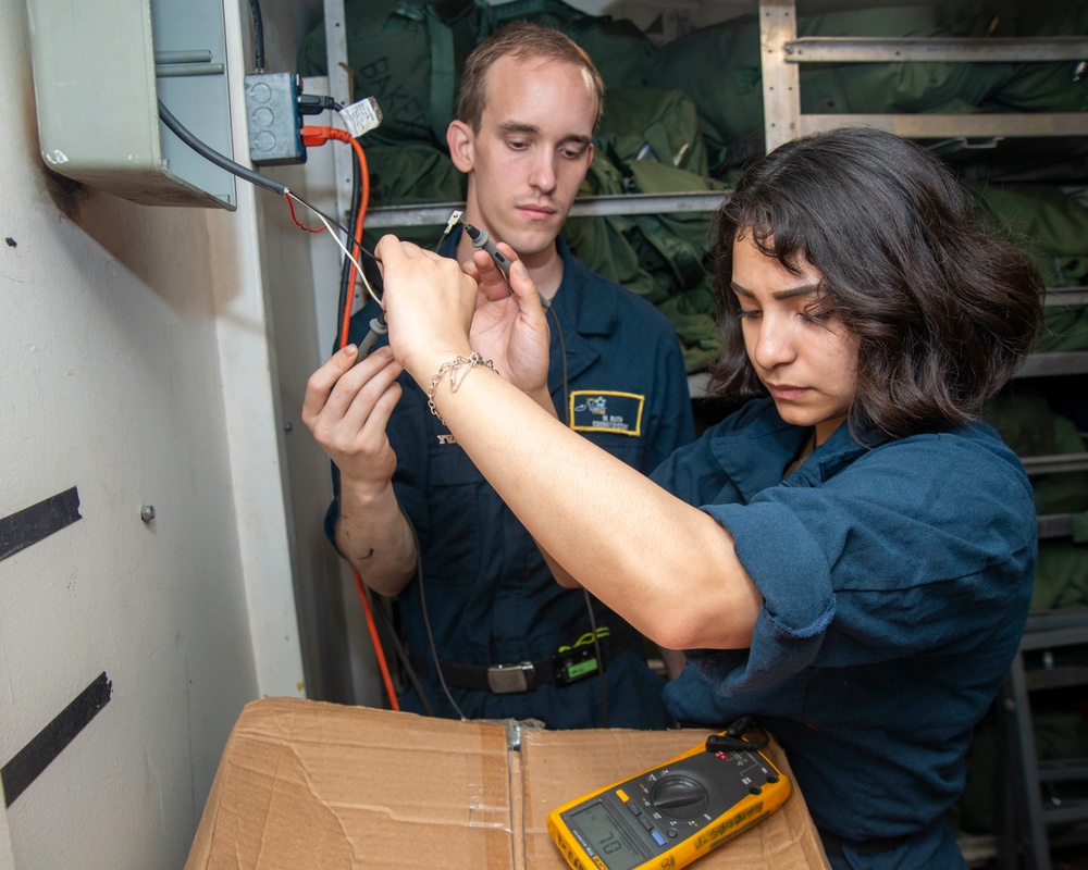 Sailors Perform An Operational Test On A Speaker