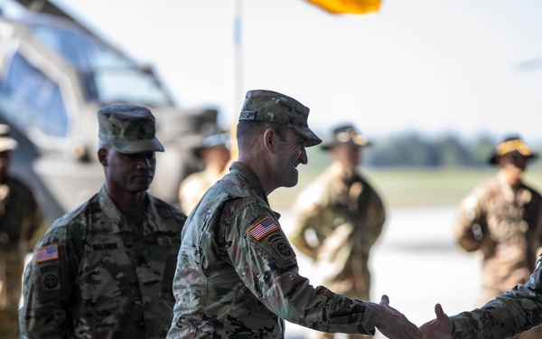 Col. Morris shakes the hand of Col. Vanek during TOA in Powidz, Poland.