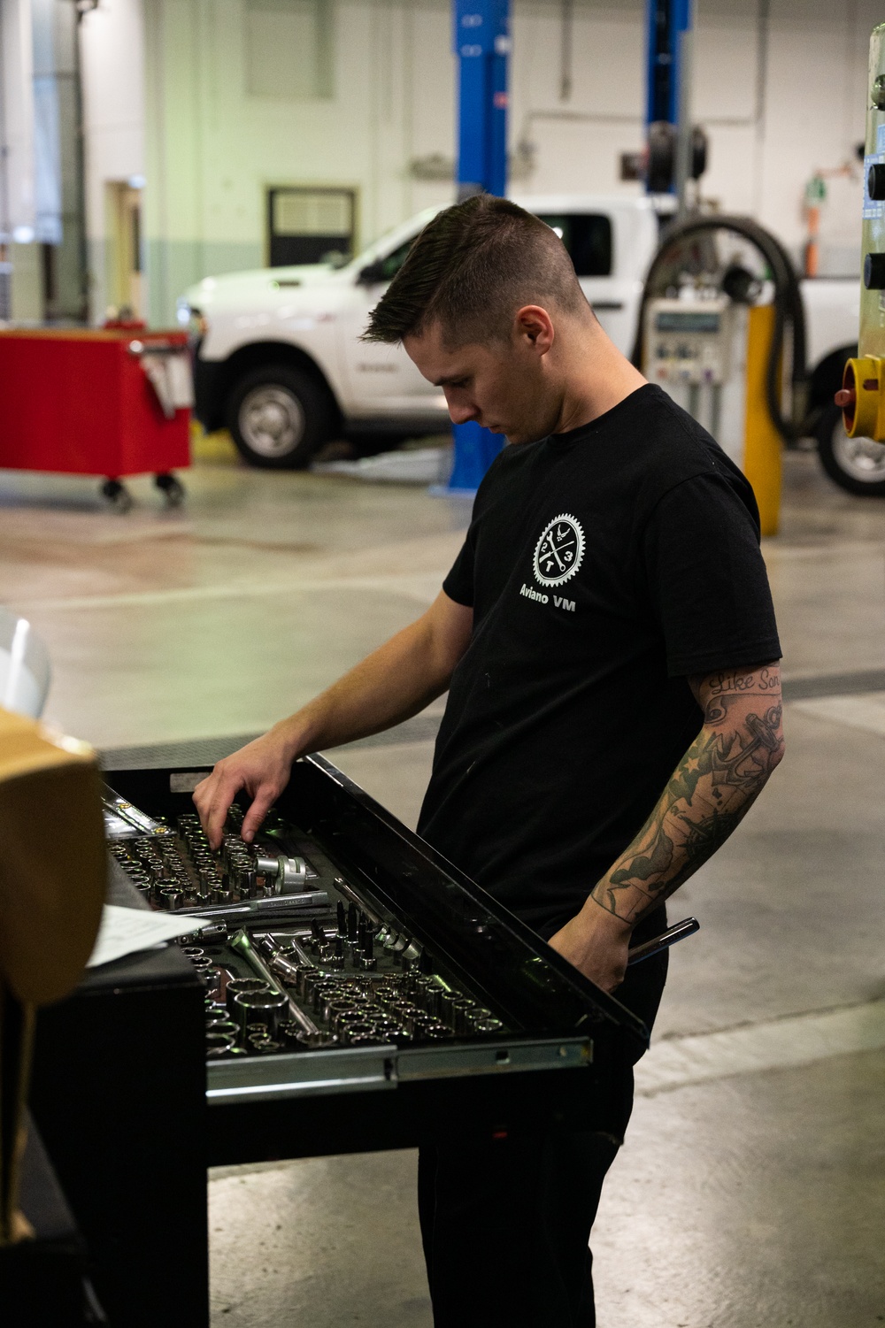 Niagara Airman selects tools for an oil change at Aviano Air Base