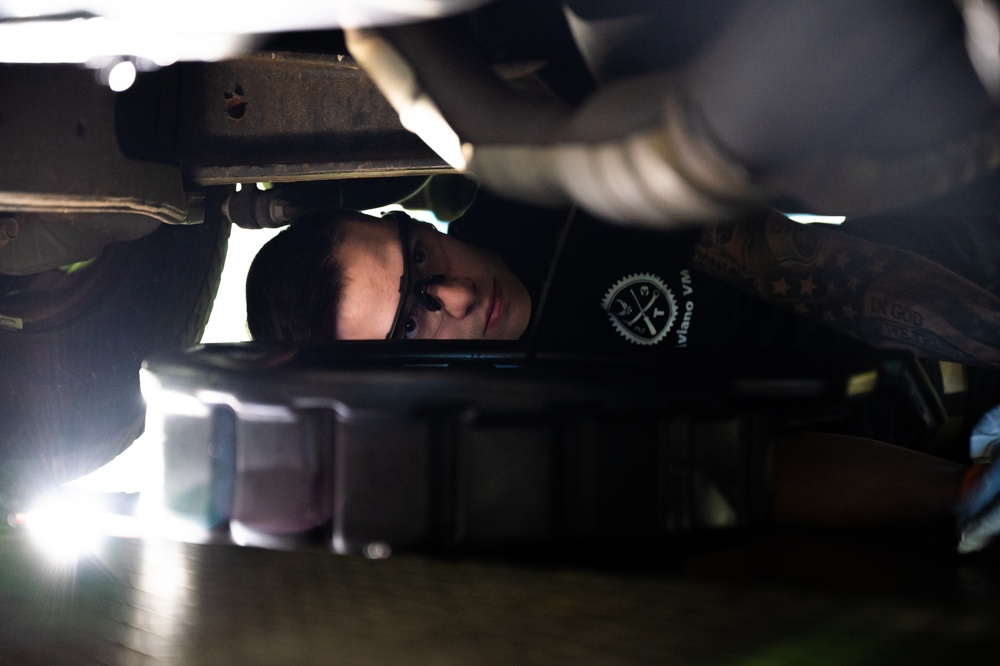 914th Airman changes oil in Ford F-350