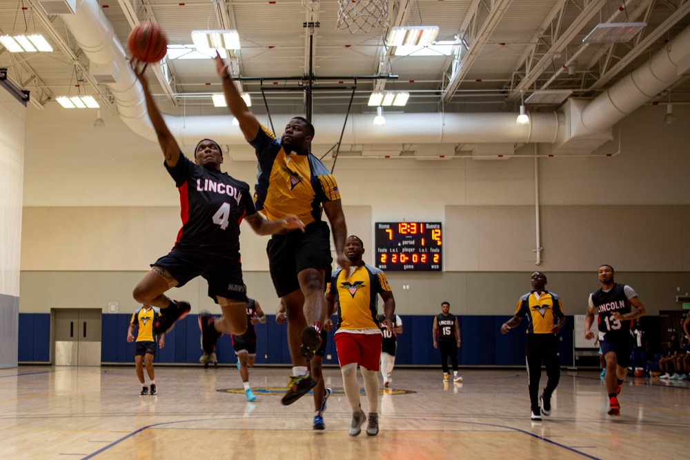 Abraham Lincoln Sailors play basketball during the Battle of the Carriers