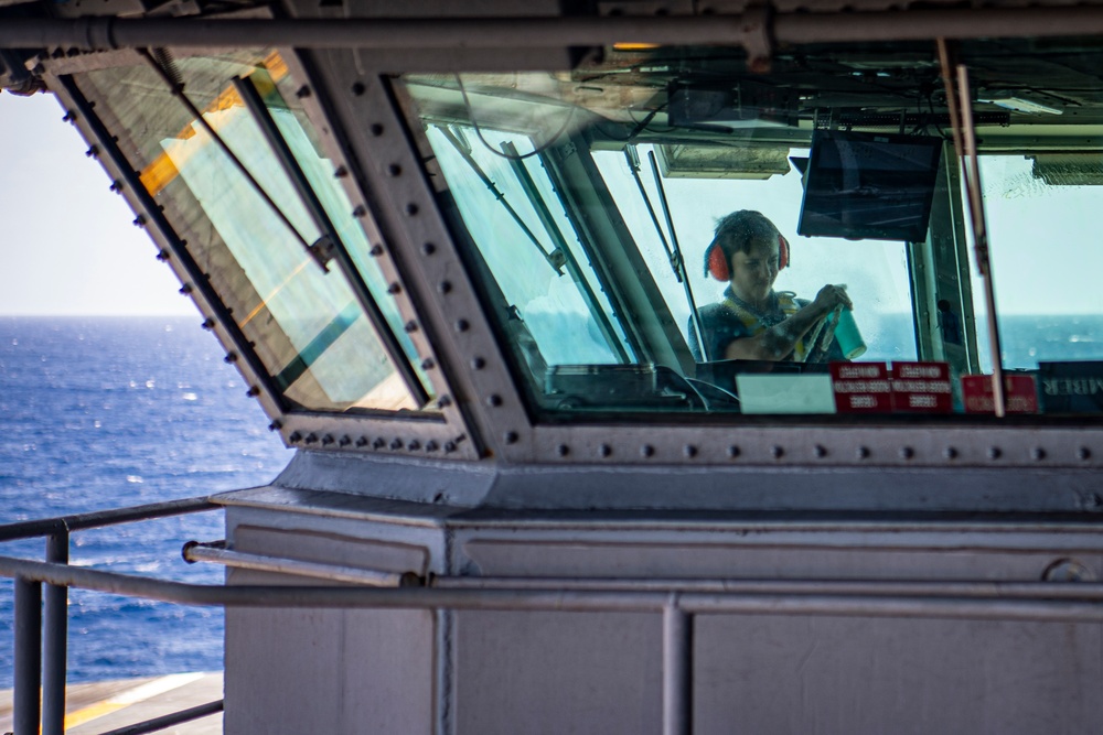 Sailors Clean Windows On The Bridge