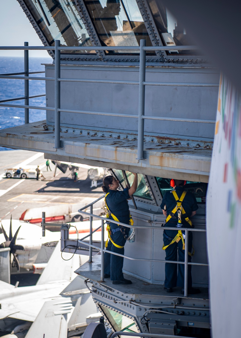 Sailors Clean Windows On The Bridge