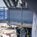 Sailors Clean Windows On The Bridge