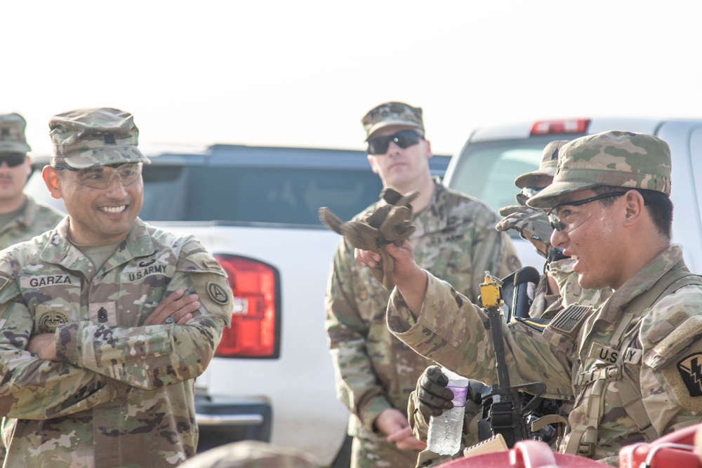 CSM Garza converses with the winners of the land navigation course