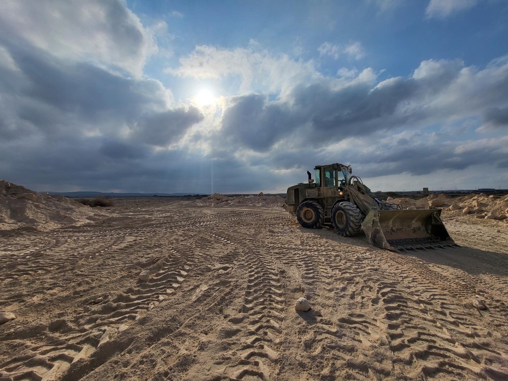 Missouri National Guard Soldiers construct entrance to new base camp