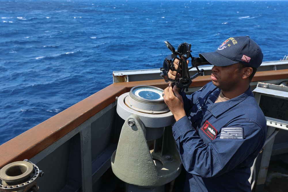 USS Ramage Sailor Takes Navigational Measurements