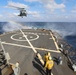 Helicopter Takes Off From USS Ramage