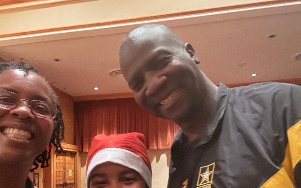 Col. Dominique Cummings with her husband and daughter