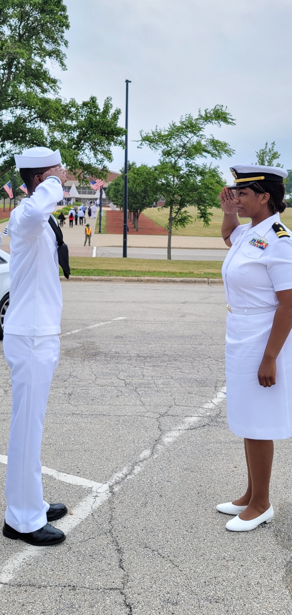 CTTSN Trent Gilliam salutes his mother LT Deshawnda Gilliam after graduating Navy Bootcamp.