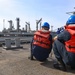 USS Ramage Sailors Holding Line During Refueling