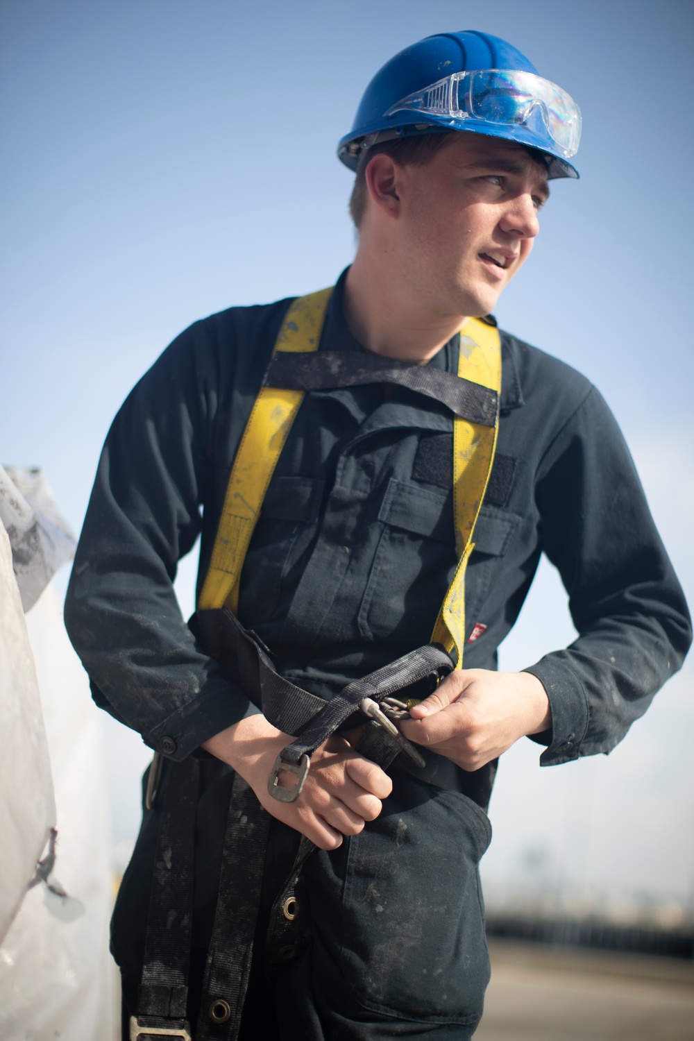 USS Tripoli Sailors Continue To Paint The Ship’s Hull During SRA