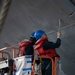 USS Tripoli Sailors Continue To Paint The Ship’s Hull During SRA