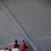 USS Tripoli Sailors Continue To Paint The Ship’s Hull During SRA