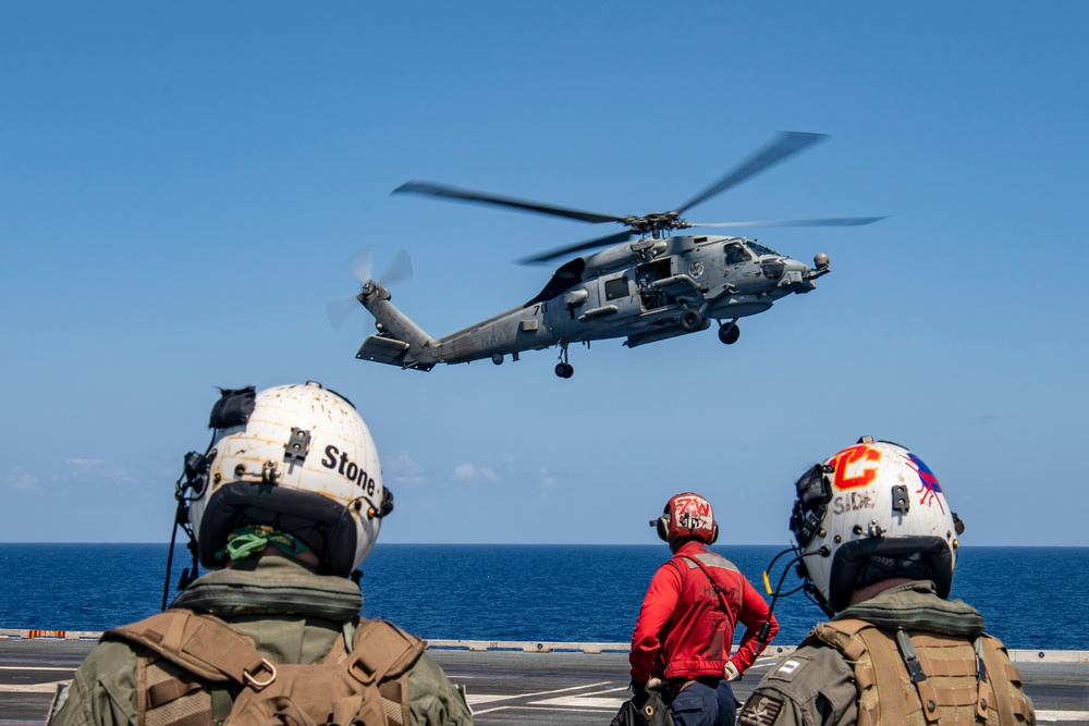 Helicopter Lands On Flight Deck