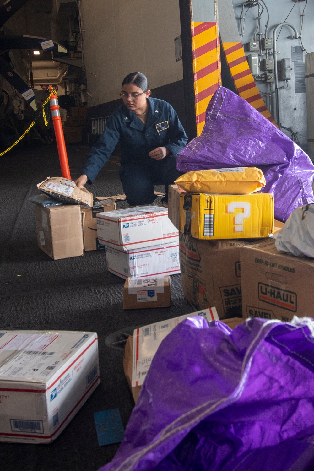 U.S. Navy Sailor Sorts Mail