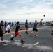 Sailors Play Football On The Flight Deck During Steel Beach Picnic