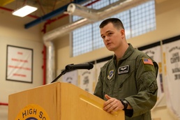 Airman thanks Yokota educators for 50 years of service with combat flag