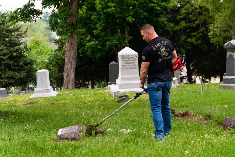 Airmen clean-up local cemetery