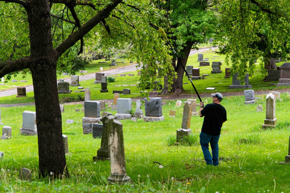 Airmen clean-up local cemetery