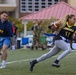 Abraham Lincoln Sailors play football during the Battle of the Carriers