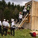 Members of the District 8, Massachusetts Bureau of Forest Control access a building