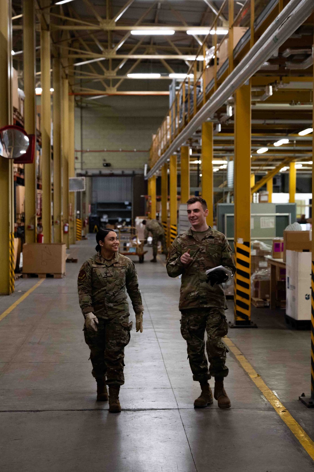 914th Airmen walk through supply warehouse at Aviano Air base