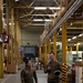 914th Airmen walk through supply warehouse at Aviano Air base