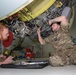 RAF maintainers measure fluid levels