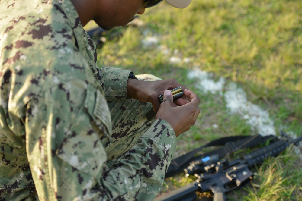 Seabees assigned to Naval Mobile Construction Battalion (NMCB) conduct weapons qualification for the M-4 rifle