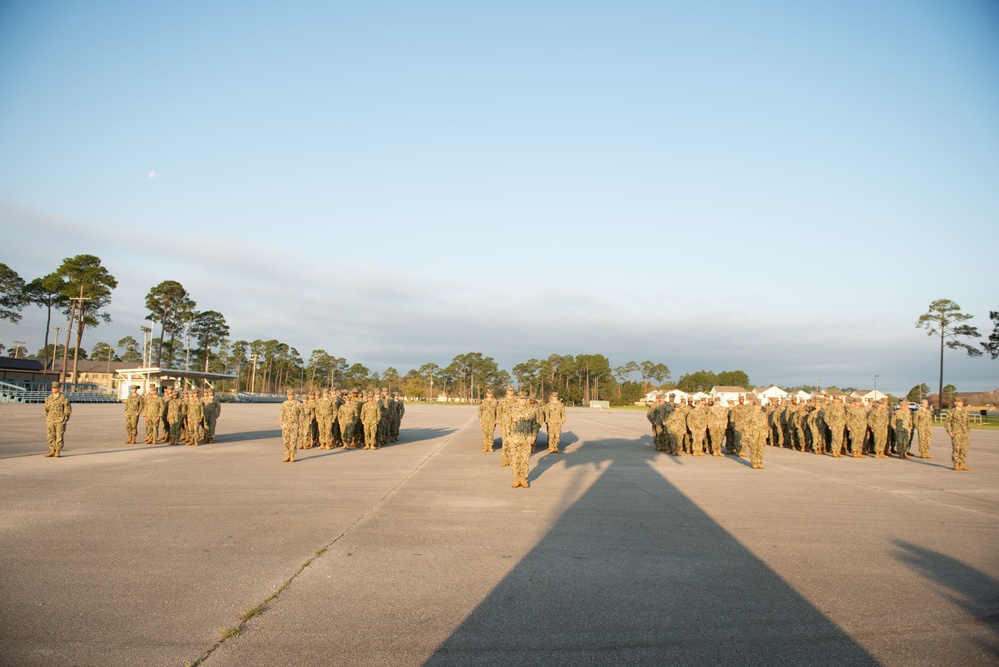 Seabees assigned to Naval Mobile Construction Battalion (NMCB) 14 conduct morning formation.