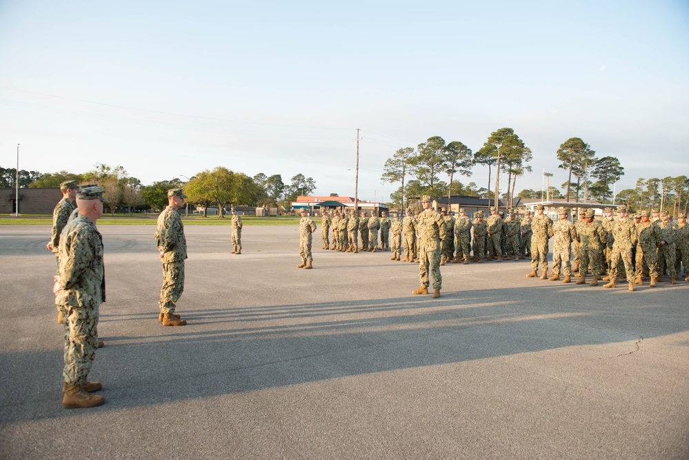 Seabees assigned to Naval Mobile Construction Battalion (NMCB) 14 conduct morning formation.