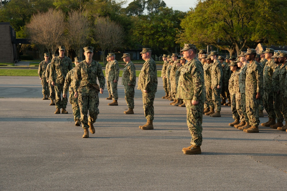 Seabees assigned to Naval Mobile Construction Battalion (NMCB) 14 conduct morning formation.