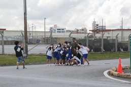 LOCAL WALK EVENT CONNECTS TWO A-FENCE-AWAY COMMUNITIES / フェンスを超えて２つの地域をつなぐ「てだこウォーク」