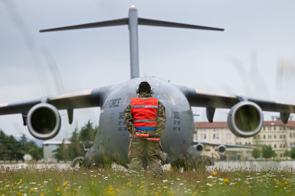 Airman marshals C-17 Globemaster III before takeoff