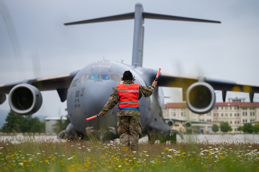 Airman marshals C-17 Globemaster III before takeoff