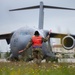 Airman marshals C-17 Globemaster III before takeoff