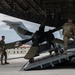 Airmen load aircraft propeller onto C-17