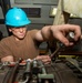 Sailor Tightens Bolts On Jet Engine Using Torque Wrench