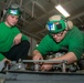 Sailors Perform Flight Control Inspection On A Helicopter