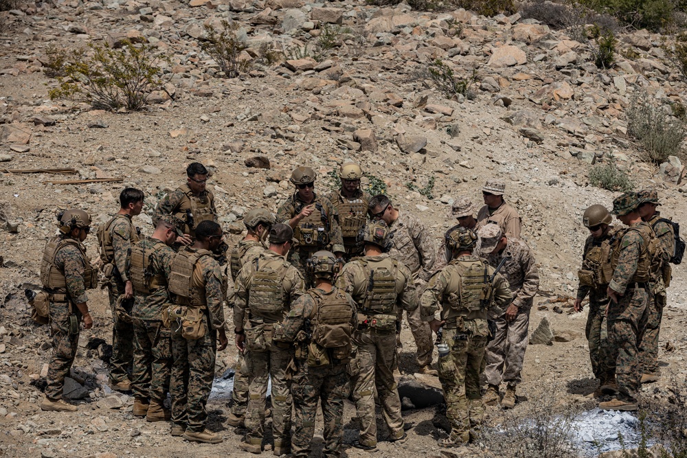 EOD Technicians plant controlled explosives as part of a training and documentation exercise for future EOD classes