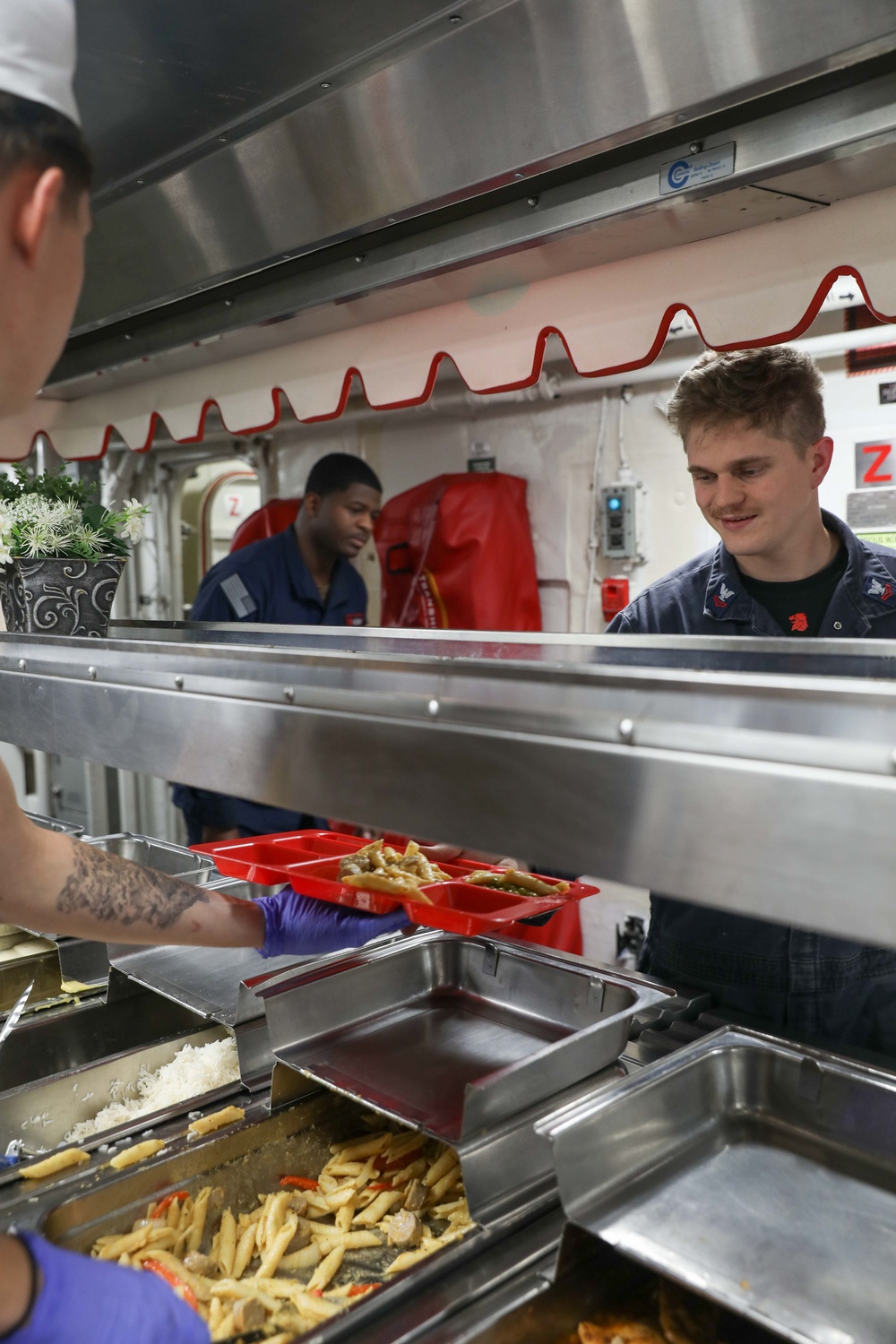 USS Ramage Sailors During Dinner