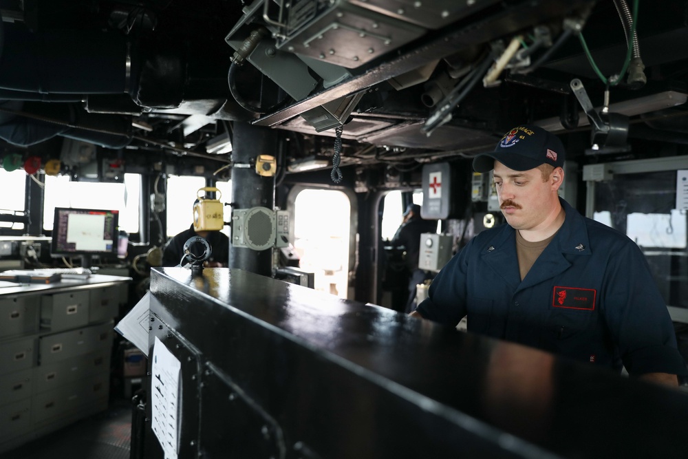 USS Ramage Sailor Mans the Helm