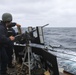 USS Ramage Sailor Reload Machine Gun