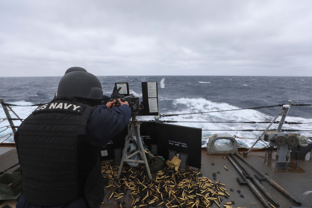 USS Ramage Sailor Fires Machine Gun