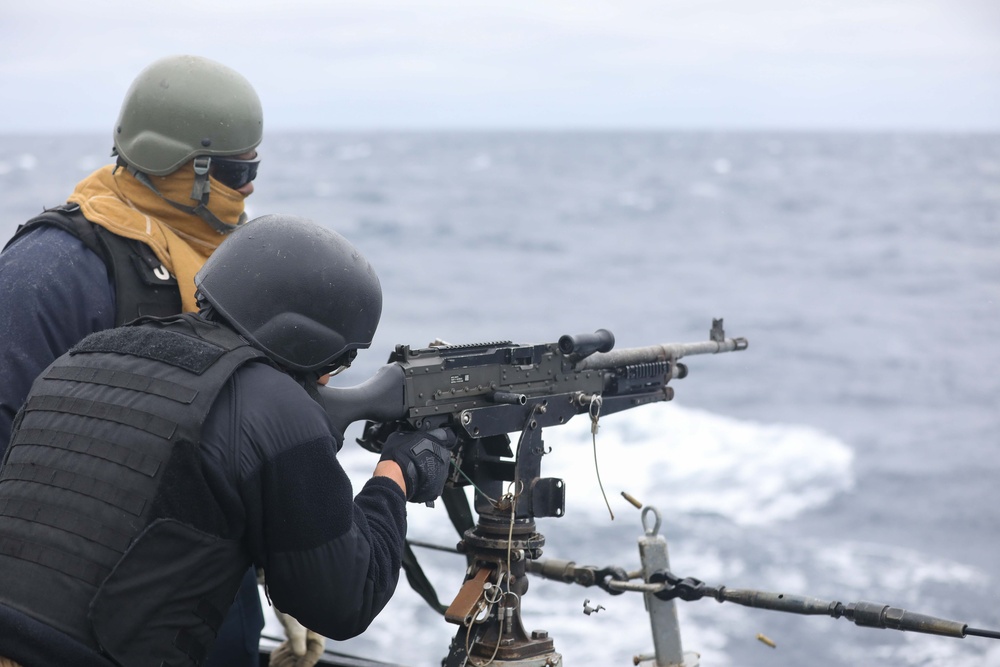 USS Ramage Sailor Fires Machine Gun